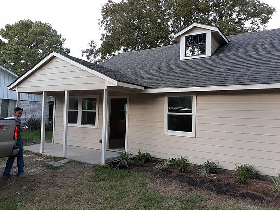 Front of home. All new siding, landscaping, paint