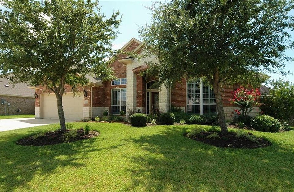 Spectacular curb appeal with stone, brick and landscaping.