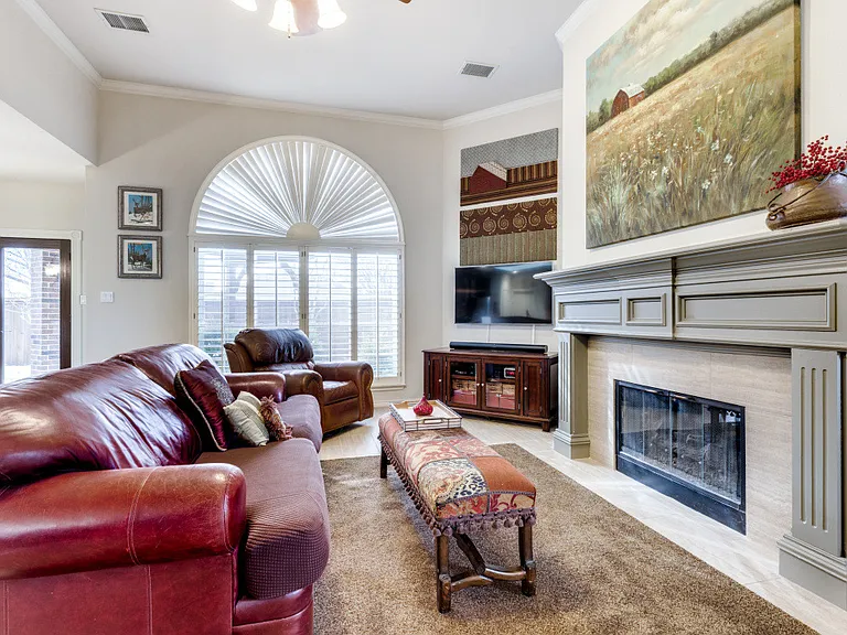 Large window with plantation shutter. High ceiling.