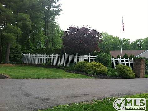 Fence surrouding entrance of home