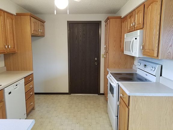Great kitchen (refrigerator will be put in for you too) door leading out to the garage.