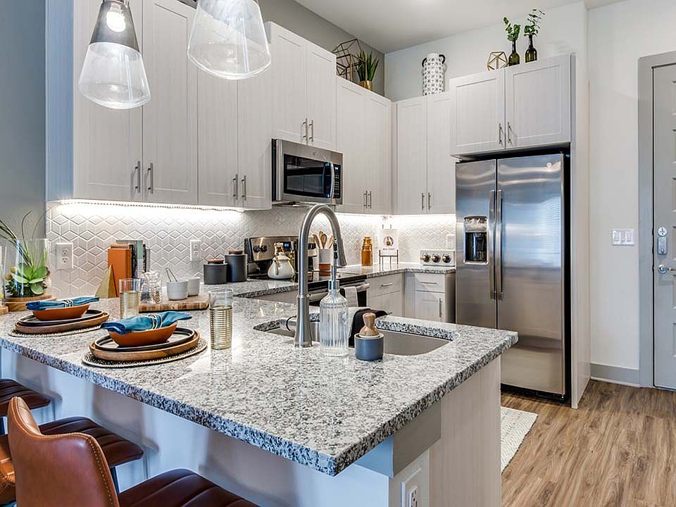 Griffis Frisco apartment kitchen with stainless steel appliances.