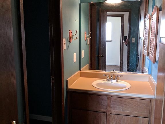 Bathroom has shared toilet and bath, with sinks on either side - great for roommates.