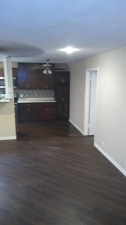 Charming 3-Bed Home with New Hardwood Floors, Fenced Yard & Attached Garage in Garland — Photo 3