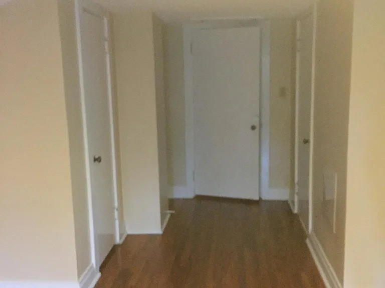 Bedroom entry door middle, walk-in closet left, bathroom door right