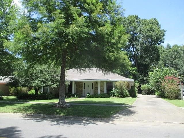 distant view showing driveway to double carport