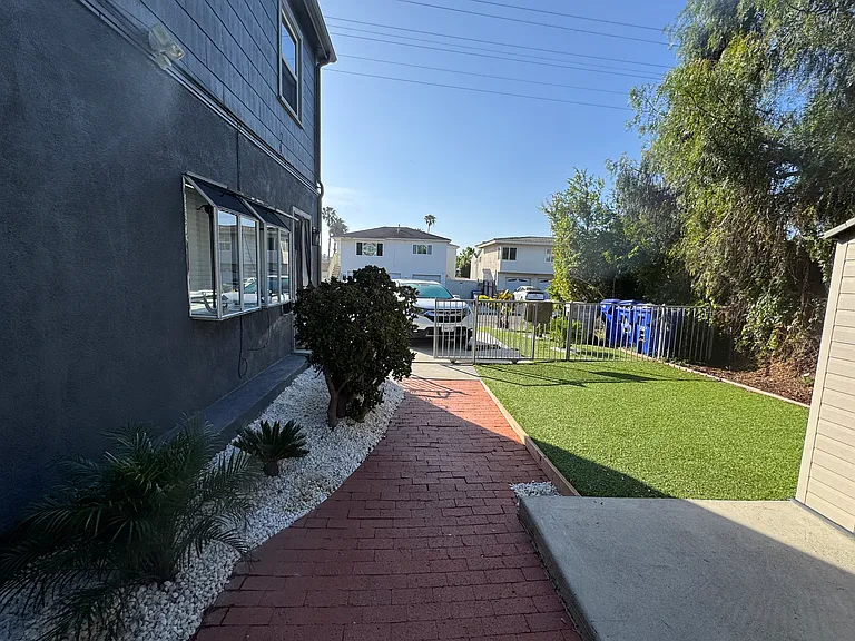 Front yard secured by gate. Perfect for a dog!