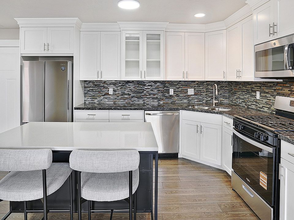 Open kitchens with islands provide space for cooking, dining, and entertaining.