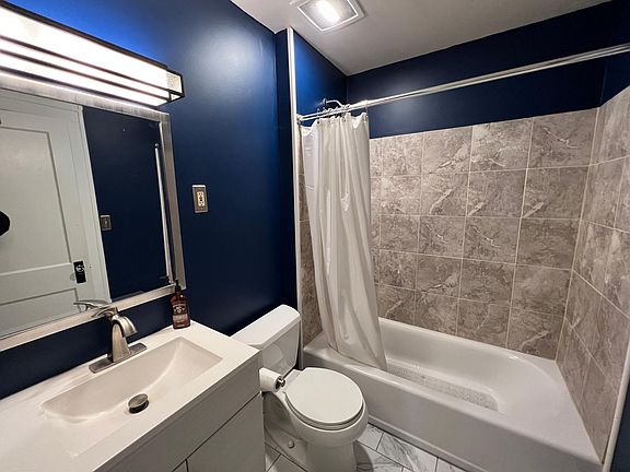 Bathroom with shower and tub combo