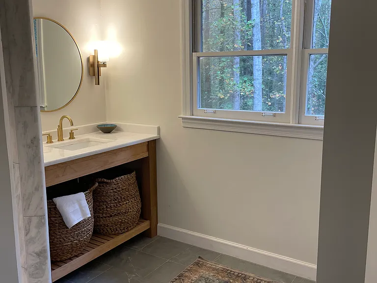 Upstairs hall bath with marble shower to left.