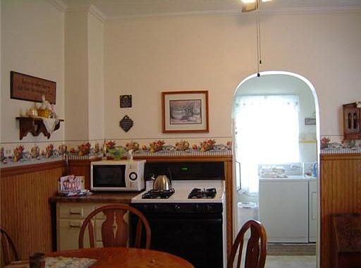 Opens to laundry, powder room and back door.