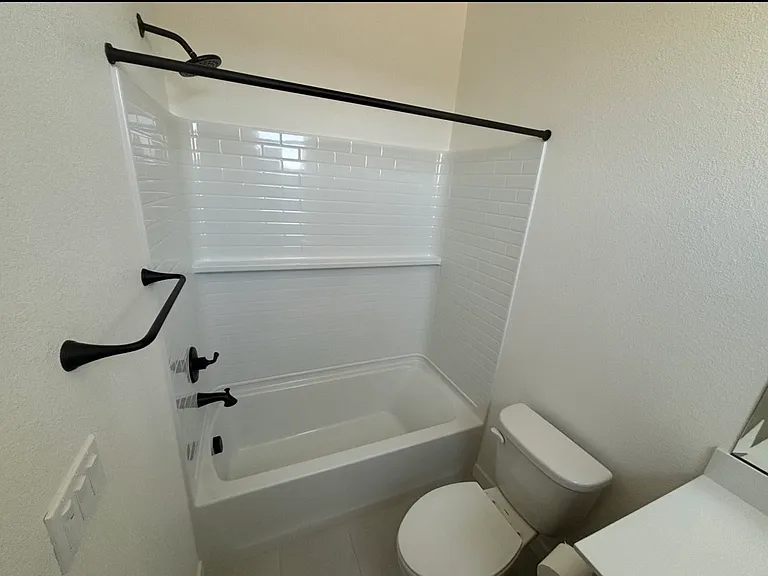 Bathroom with shower and full bath and toliet