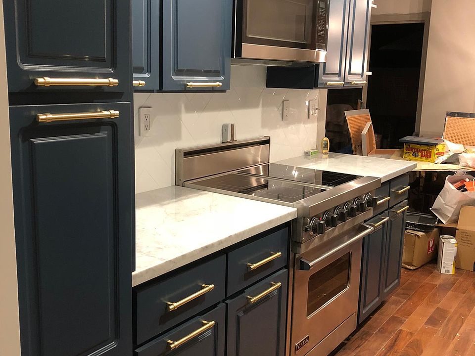 remodeled kitchen with viking stove, marble counters