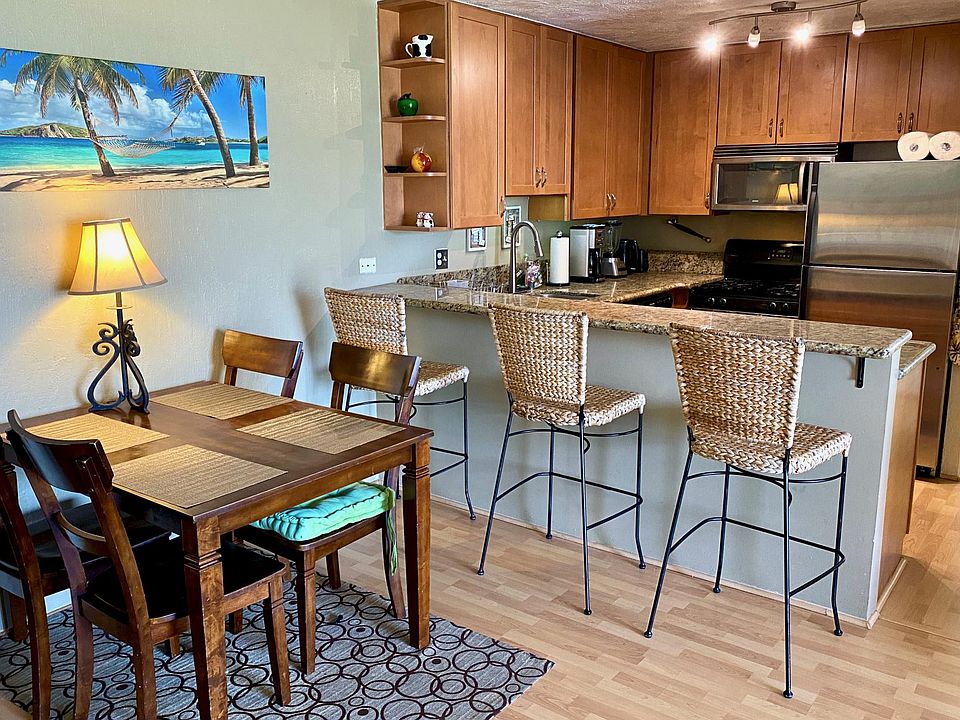 A dining area and a kitchen bar