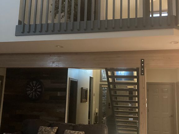 Primary bedroom and another bedroom upstairs
Entryway