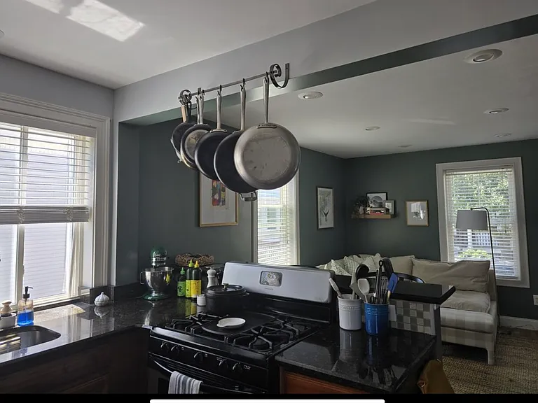 Kitchen equipped with Stainless gas range, stainless fridge, and stainless full size dishwasher.