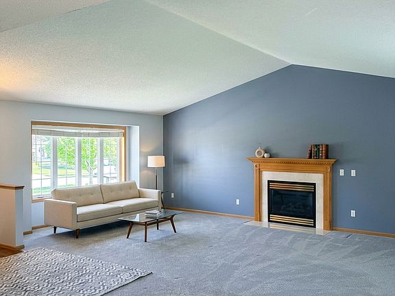 Large open living room with gas fireplace.