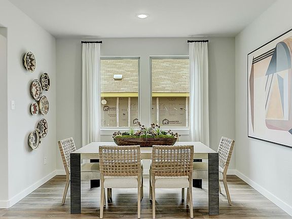 Dining room in the Oak home plan by Trophy Signature Homes - REPRESENTATIVE PHOTO