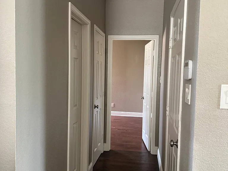 Hallway to downstairs bedroom