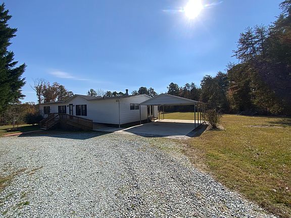 Covered carport that connects to side entrance of house