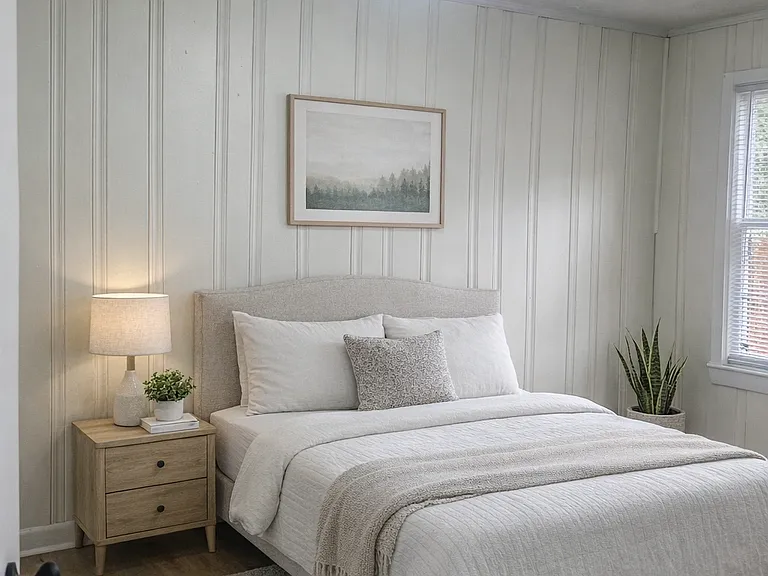 Comfortable bedroom with natural light and clean finishes