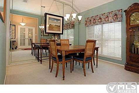 Formal Dining Room with Wall Mirror
