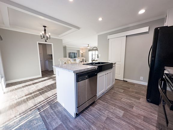 Kitchen with View of Pantry, Laundry Room, and Living Room