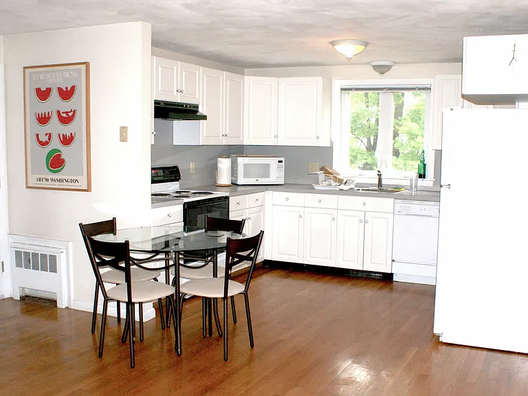 Kitchen shown with small table.