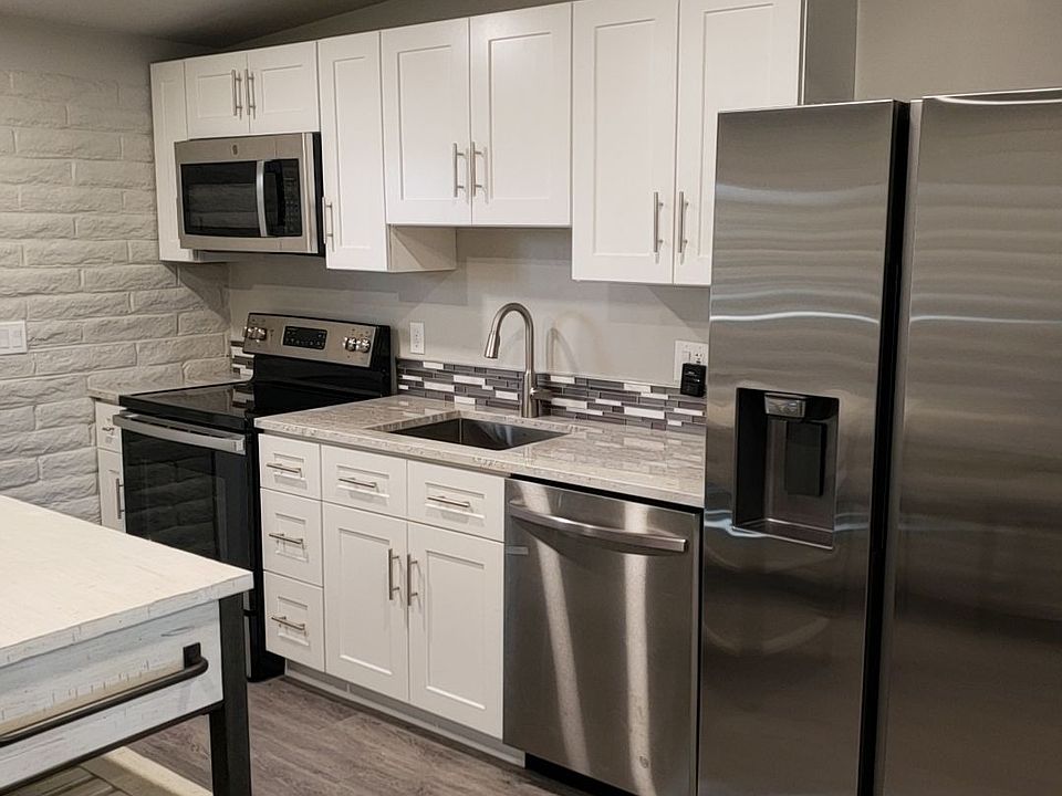 Modern kitchen completely remodeled with new appliances and granite coutertops