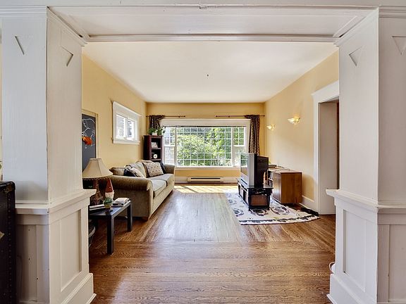 Main level unit living room with period details.