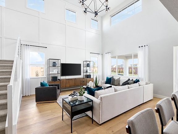 Open gathering area with view of kitchen