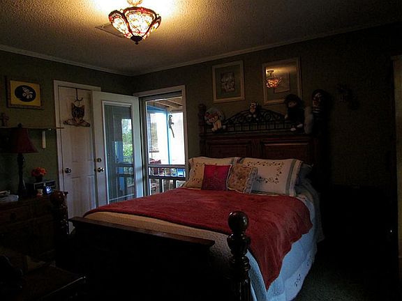 Master bedroom leading out to covered porch