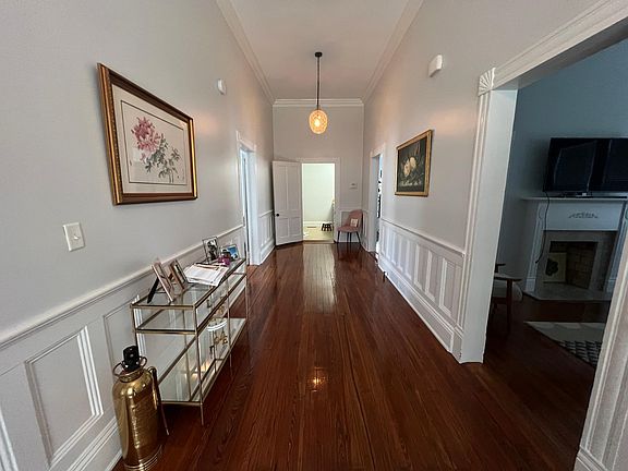 Enter in to a Great Hall with high ceilings a beautiful wood flooring