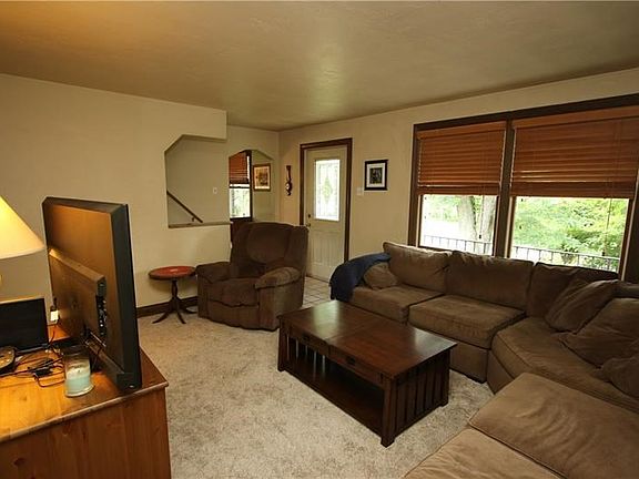 Spacious 15x13 Living Room w/ Newer Carpeting (June 2018) & Beautiful Lead Glass Front Door