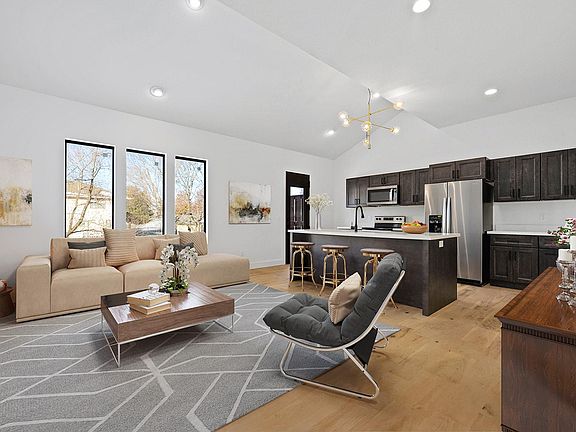 **Pictures may not be of this exact unit. Kitchen chandelier color, elevations, & hardwood type may differ.**