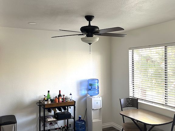 Dining room with recessed lighting. Viewed from living room and kitchen is on the left out of view.