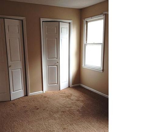 Bedroom featuring new carpets