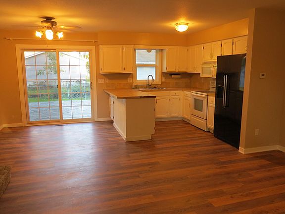 Kitchen, Dining, Living. Patio door to Deck