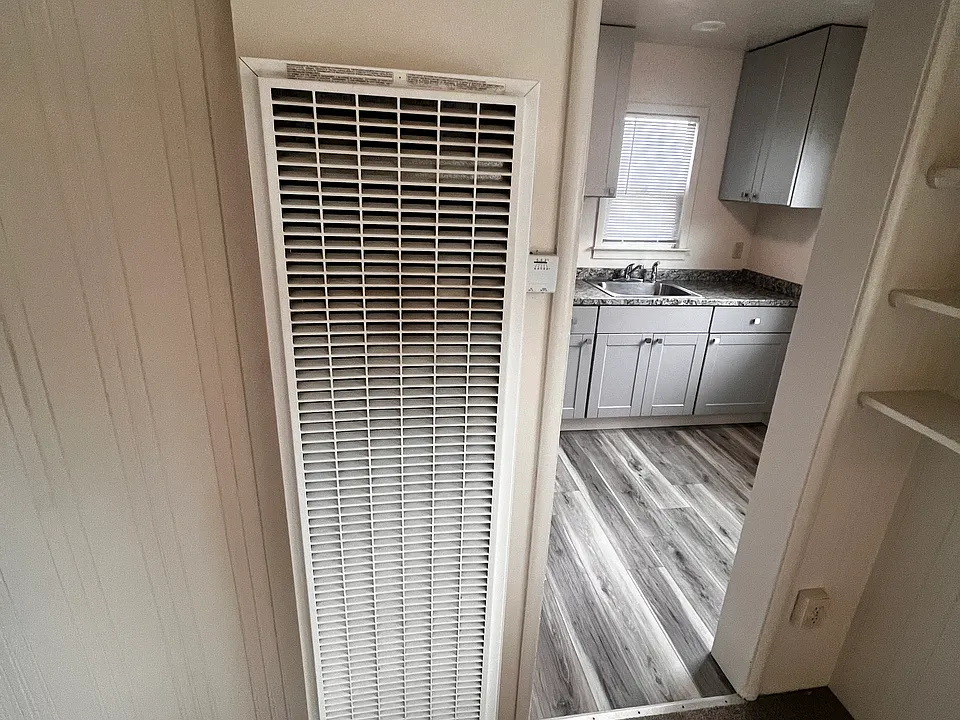 Natural gas wall heater in main room