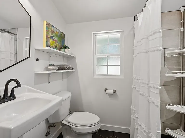 Full Bathroom and Spacious Shower