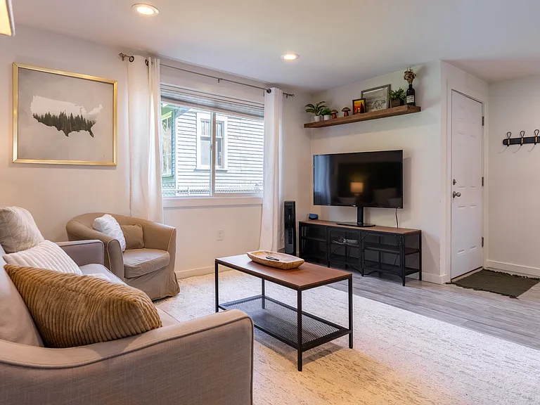 Living room, TV, facing front entrance