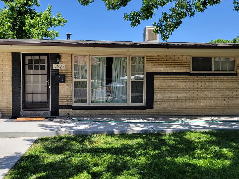 Front door entry with large south facing living room window.