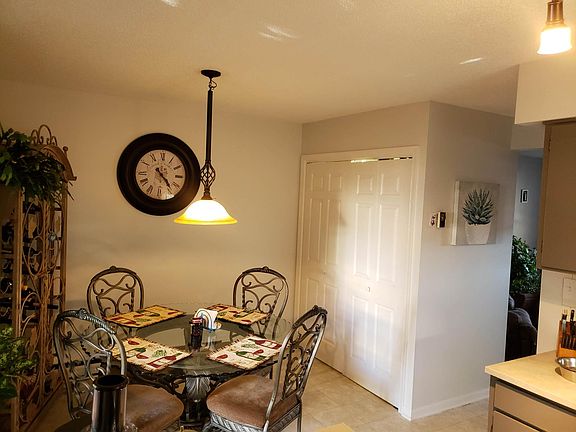 Dining area - A/C unit in wall (not visible in photo). Washer/dryer and storage in closet