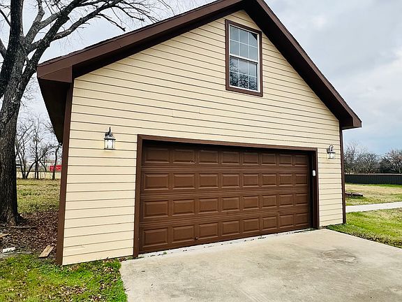 25x30 garage with electric, mini-split, and loft storage.
