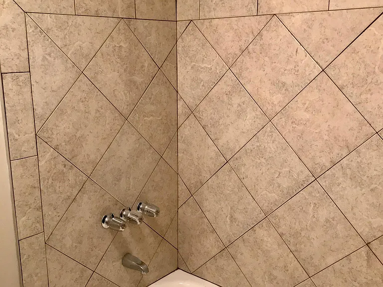 Bathroom 2 Tile floors and around tub.