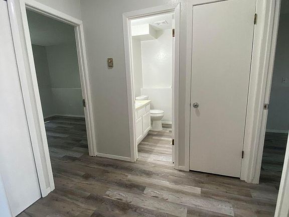 Hallway between bathroom and bedrooms