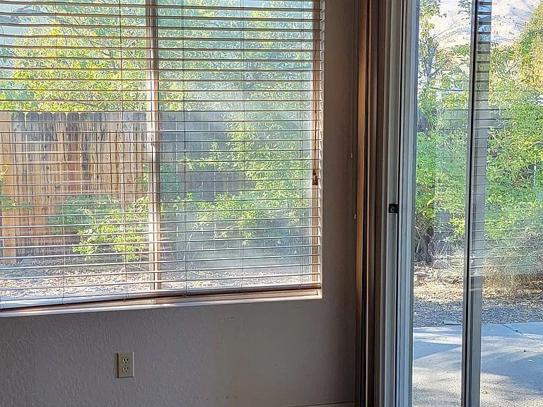 Livingroom view of patio and backyard
