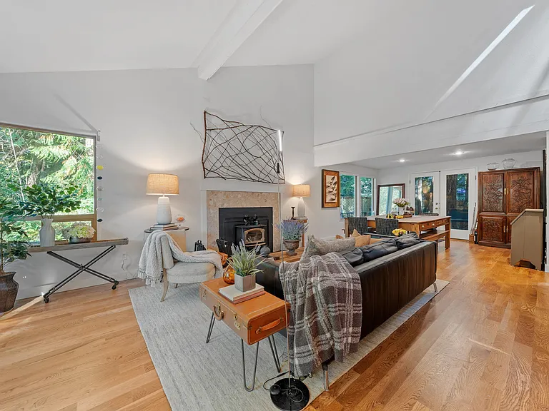 Living room view with vaulted ceilings from the front door