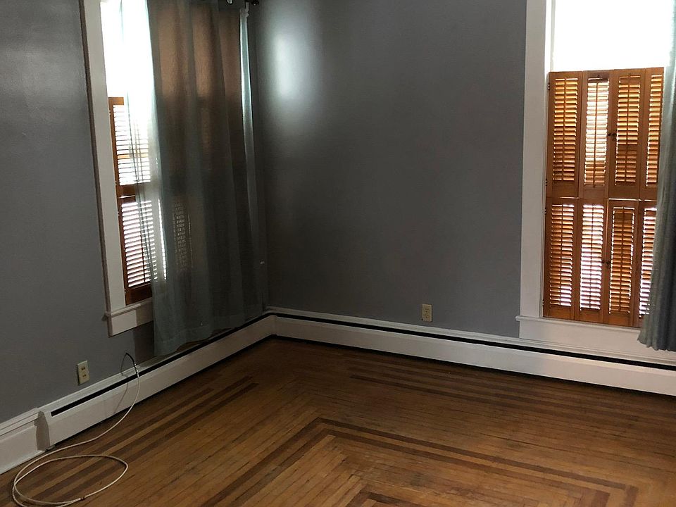 Main bedroom with beautiful wood floors and windows galore!