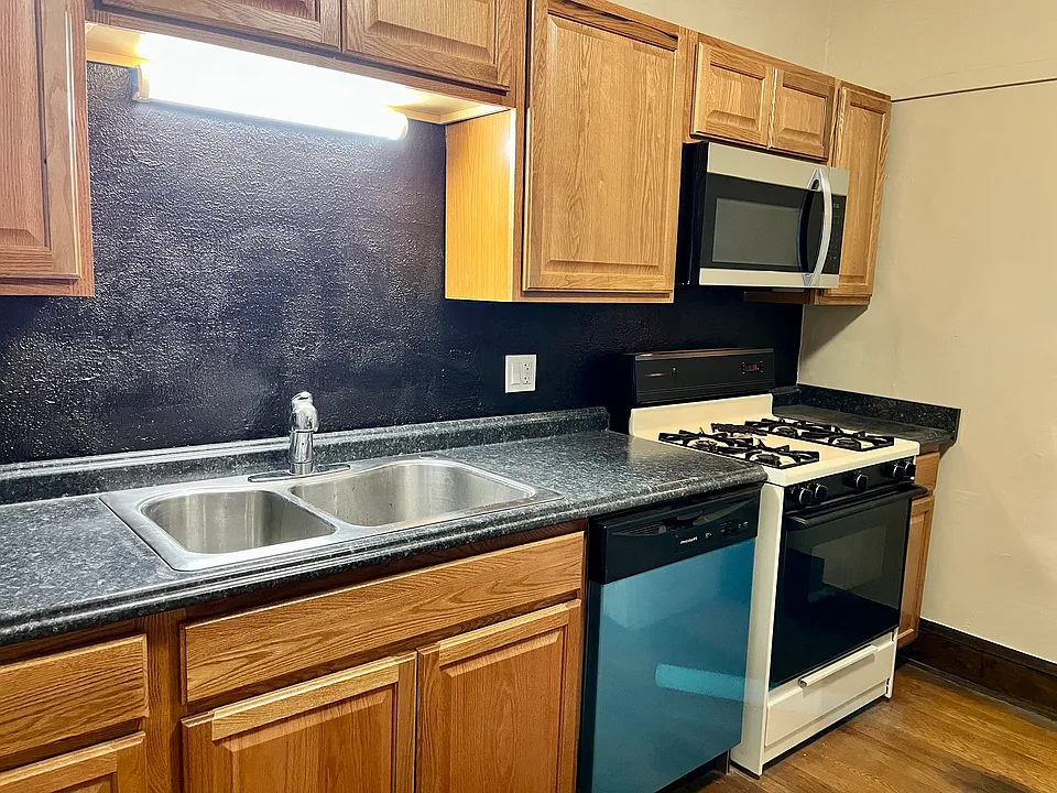 Renovated kitchen with new dishwasher, double sink and microwave
